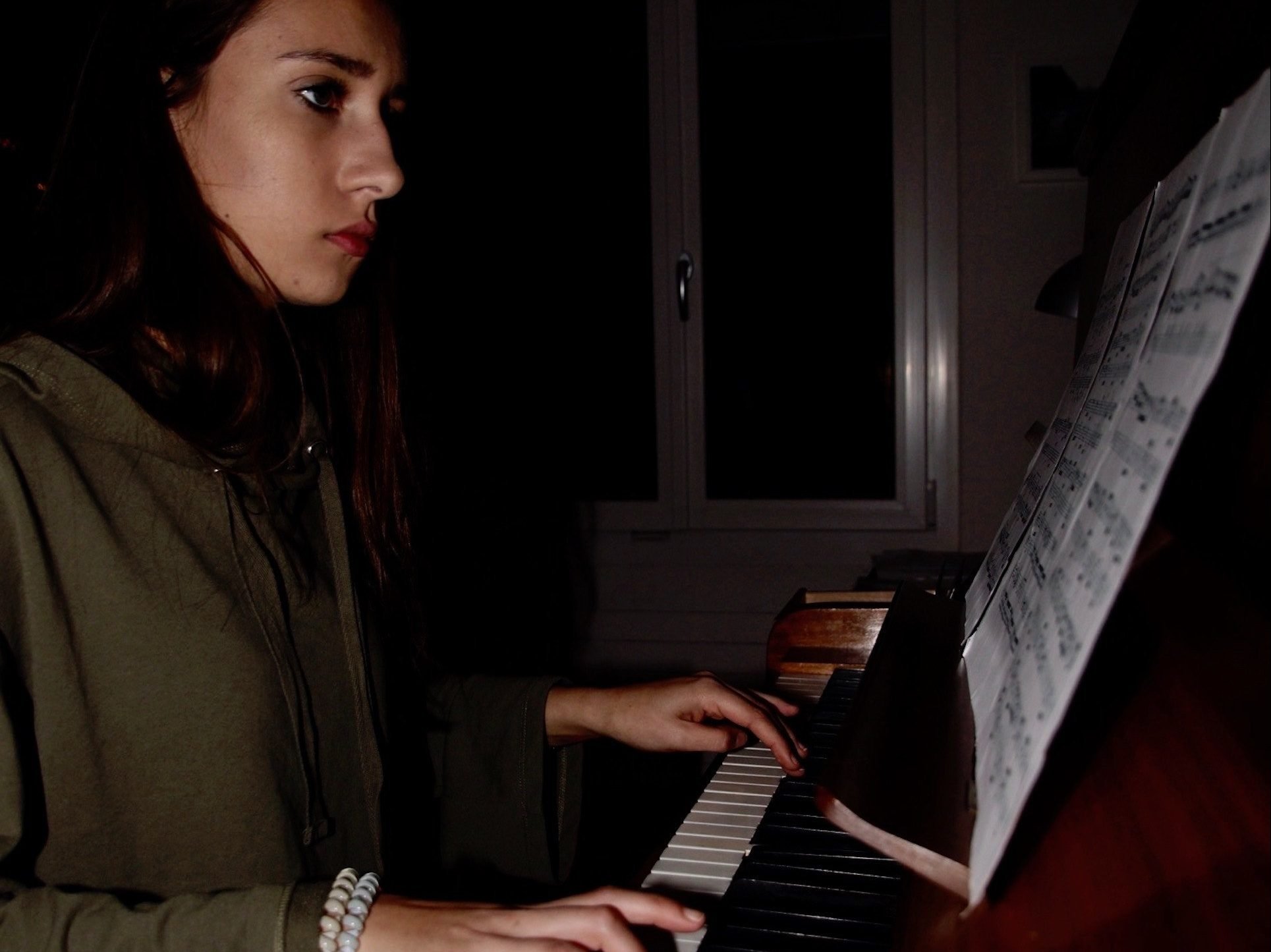 Young woman playing the piano